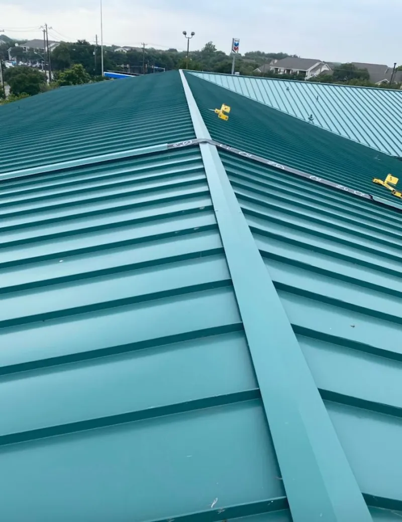 Green commercial metal roof ridge and valley for Metal Roof Repair in Baldwin